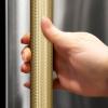 imageZLINE Autograph Edition 24 in Touchstone 151 Can Beverage Fridge with Solid Stainless Steel Door and Champagne Bronze Helix Handle RBSOZST24KCB